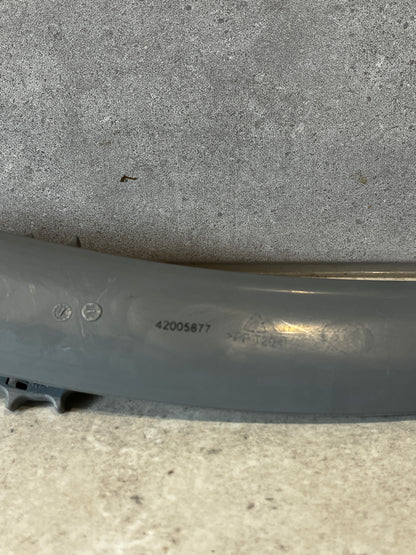 Close-up of grey plastic part showing product code and markings