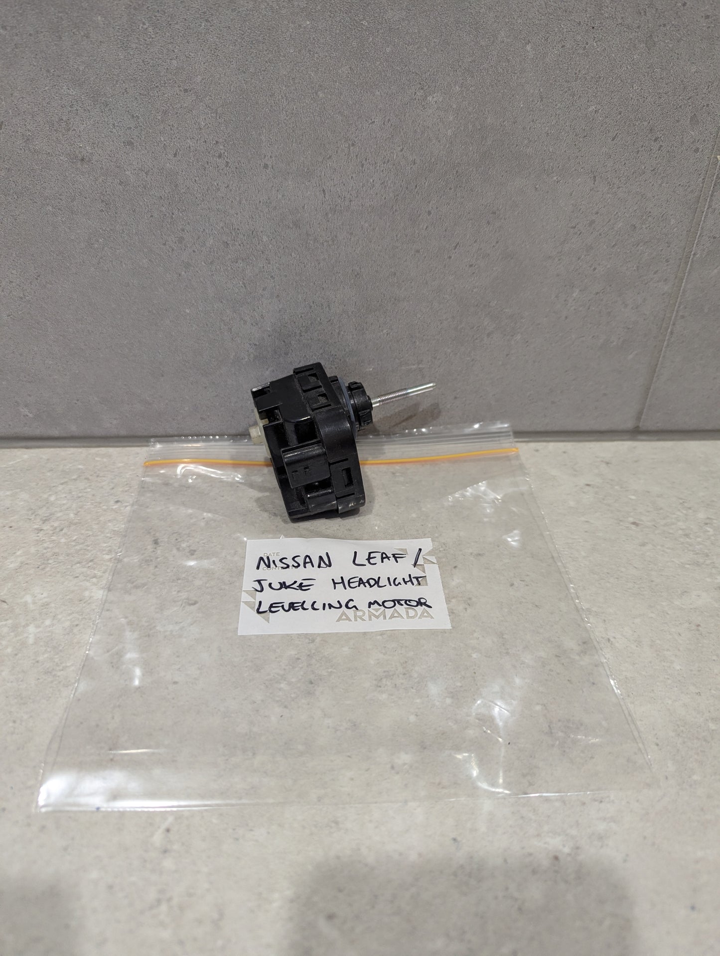 Nissan Leaf Juke headlight leveling motor with labeled bag
