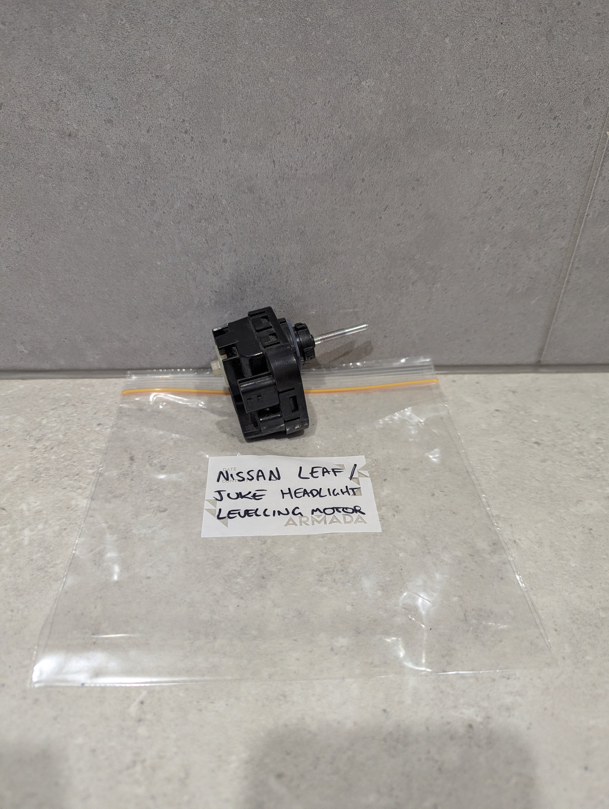 Nissan Leaf Juke headlight leveling motor with labeled bag