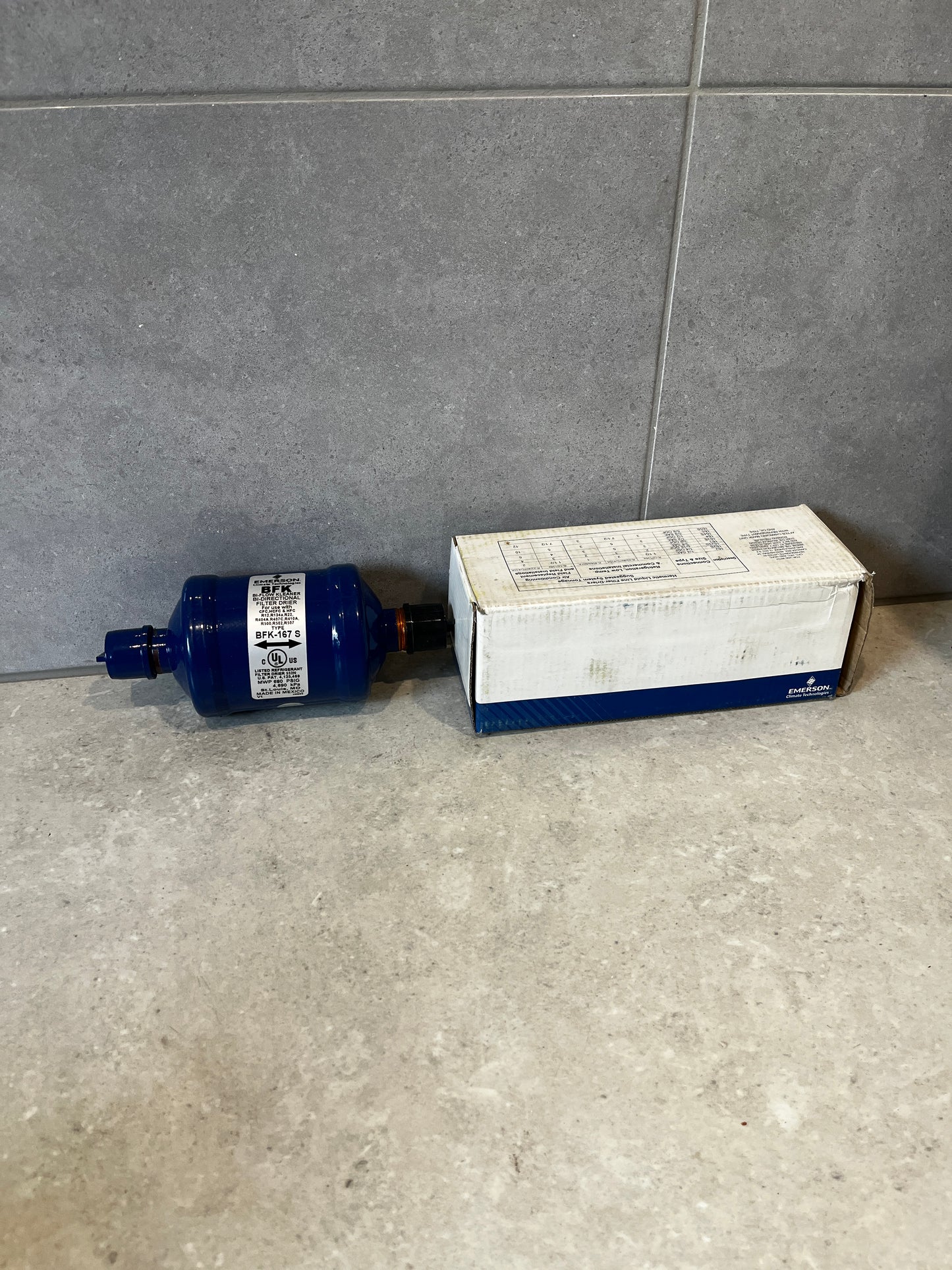 Emerson BFK-167 S filter drier with product box on countertop