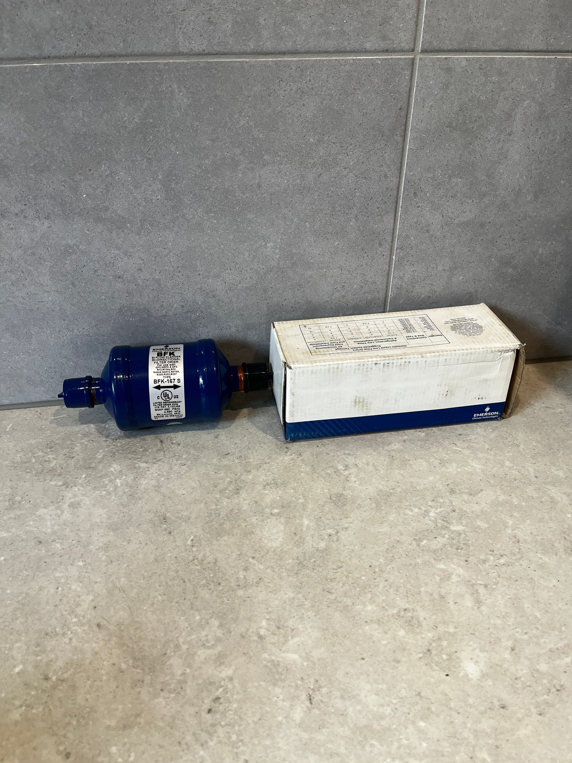 Emerson BFK-167 S filter drier with product box on countertop