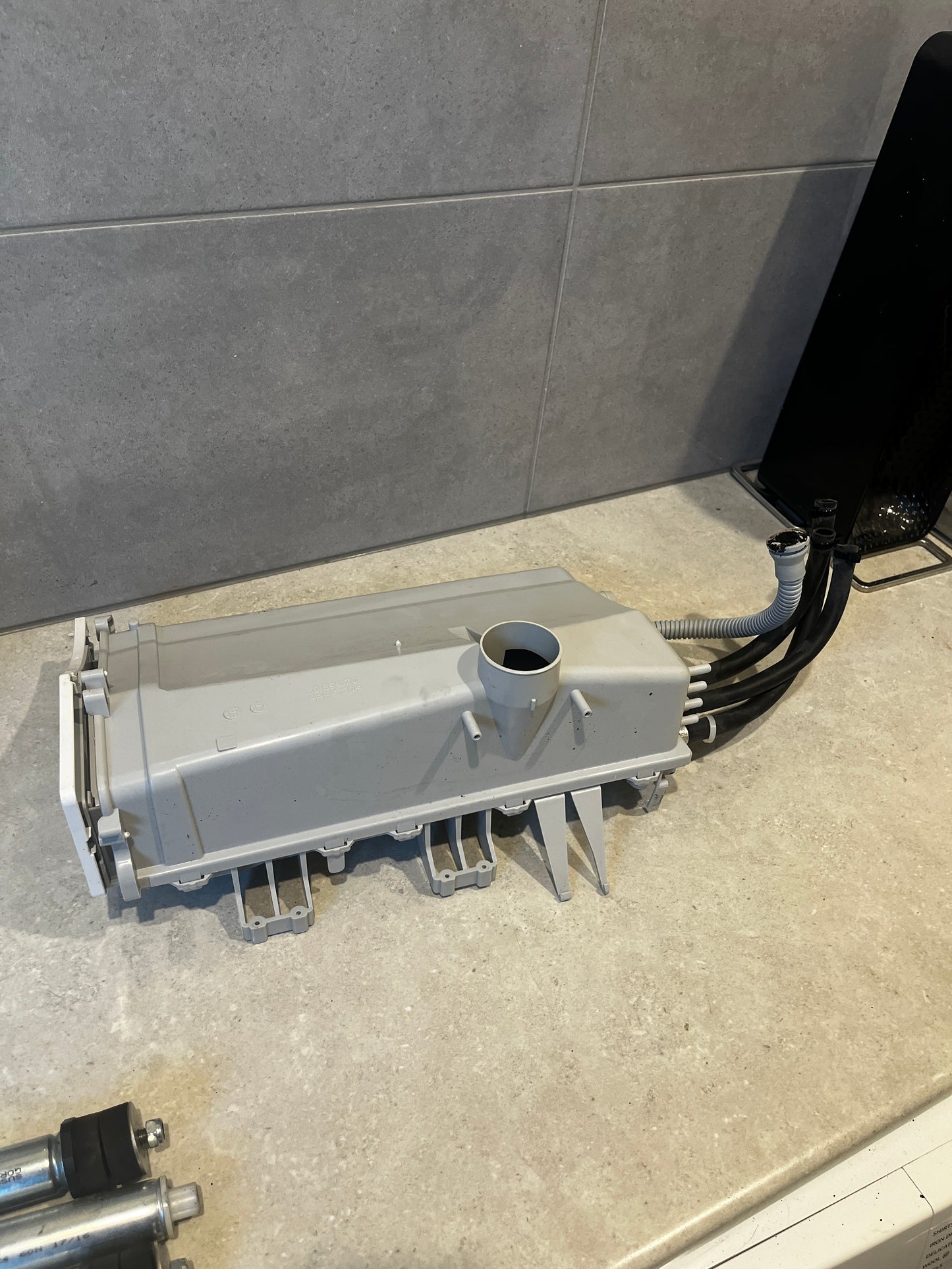 Back side of Samsung washing machine detergent drawer assembly with hoses