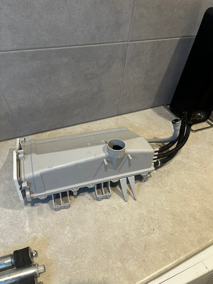 Back side of Samsung washing machine detergent drawer assembly with hoses