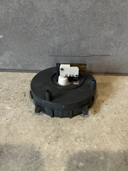 Side view of dishwasher flow sensor with electrical contacts exposed