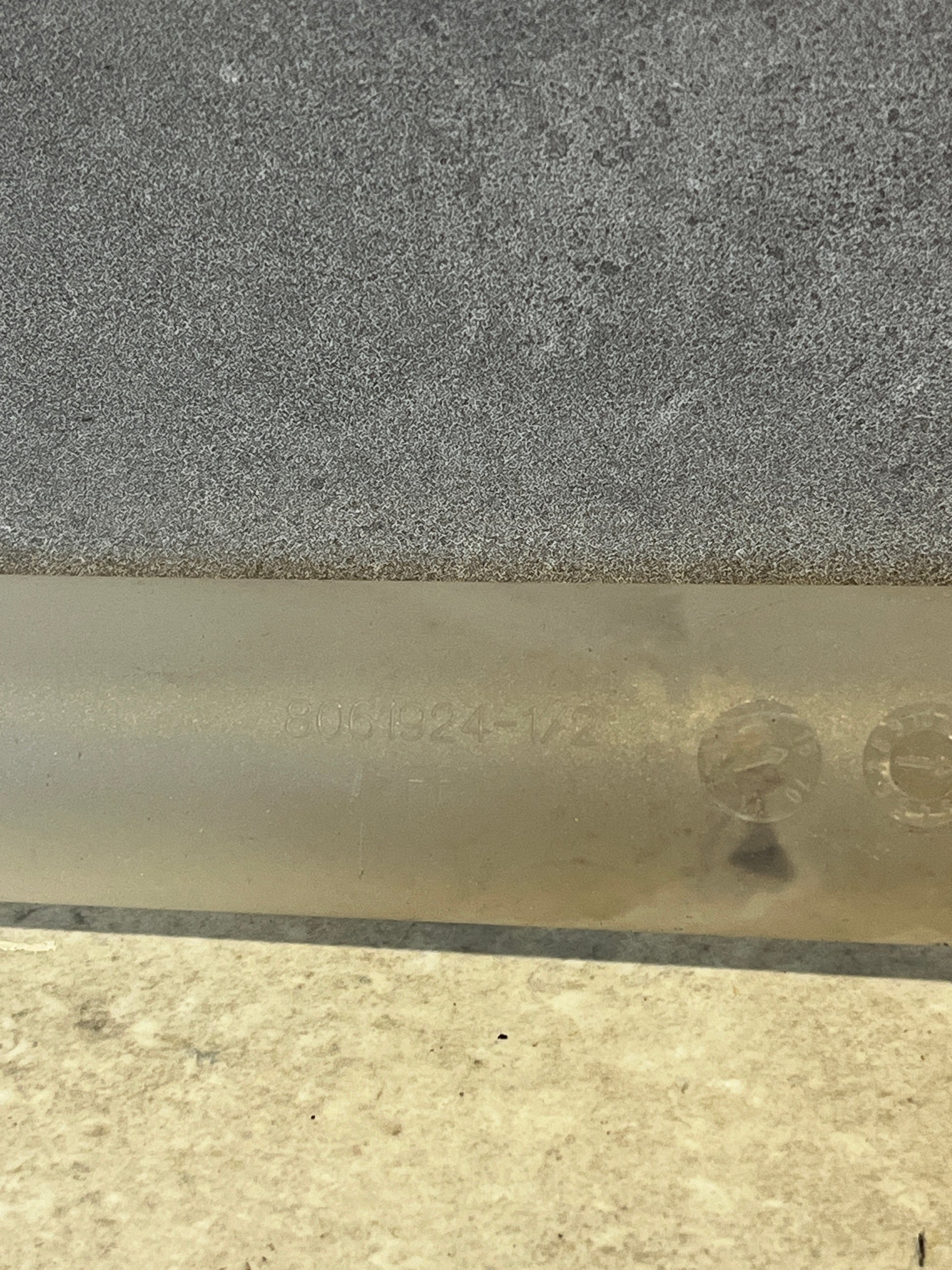 Close-up of marking on translucent plastic syringe tube