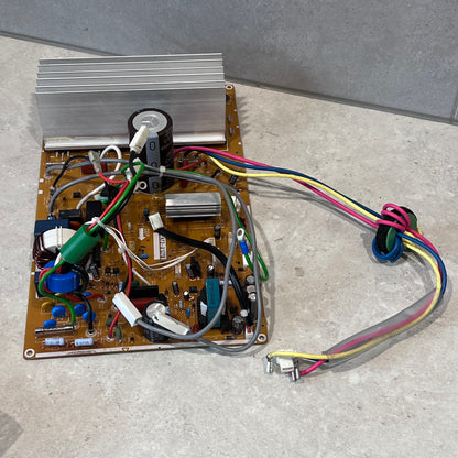 Side angle of ACXA73C55210R main PCB board showing wiring and large heat sink