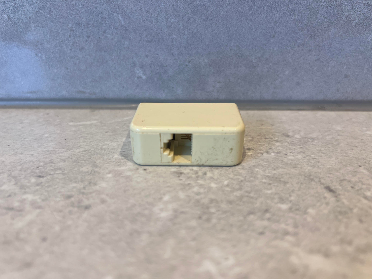 Australian telephone line adapter side view showing socket