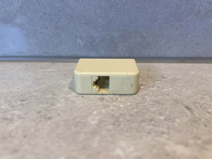 Australian telephone line adapter side view showing socket