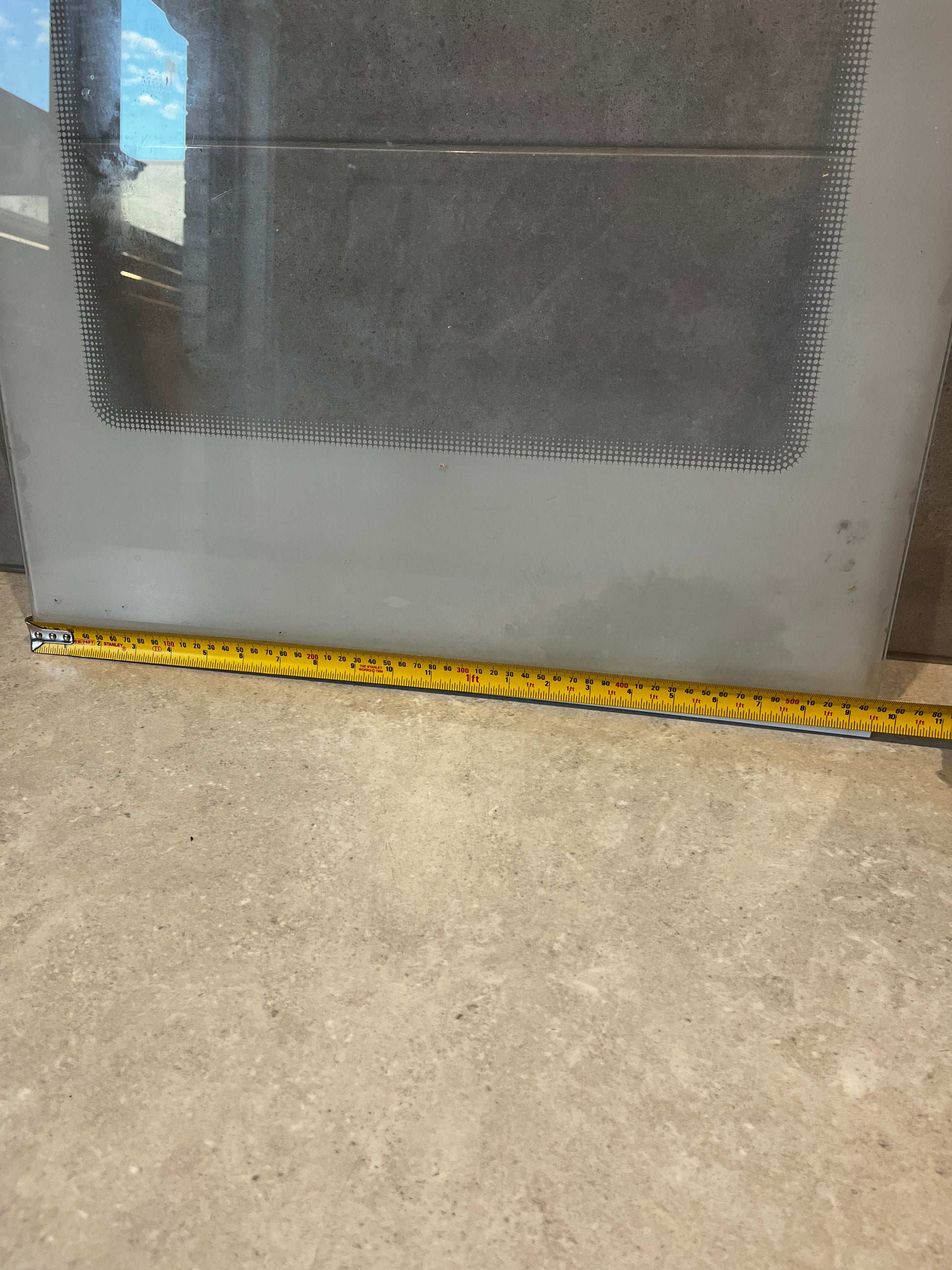 Fridge Glass  panel with visible measuring tape showing width dimensions