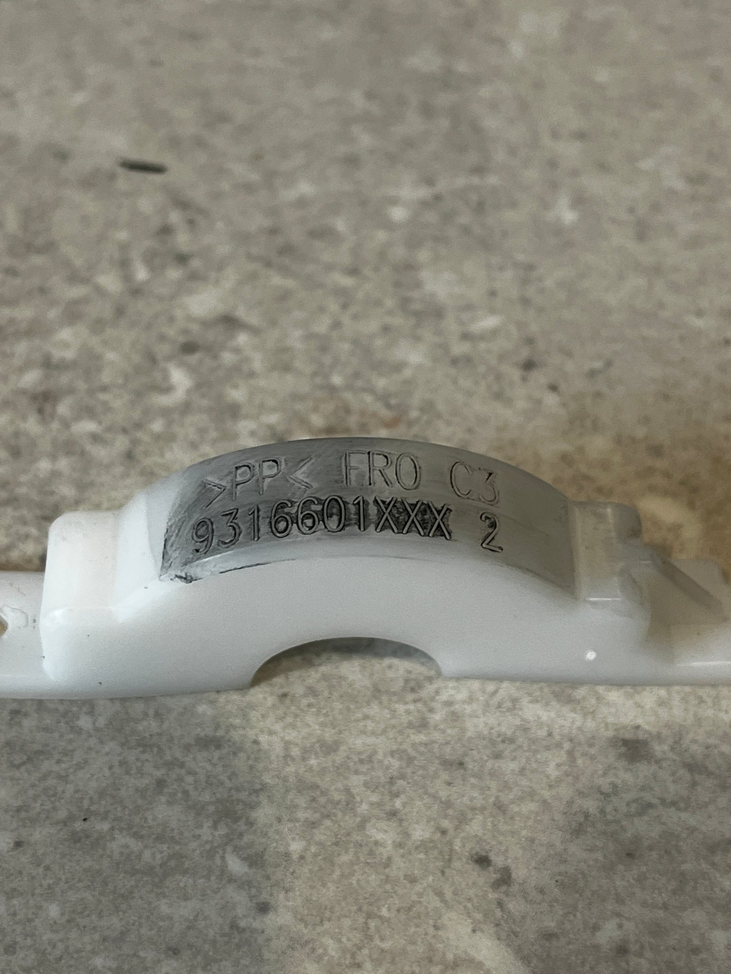 Model number and material details engraved on polypropylene pipe clamp