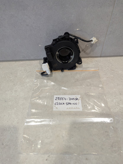 Rear view of Nissan clock spring showing wire connectors and housing