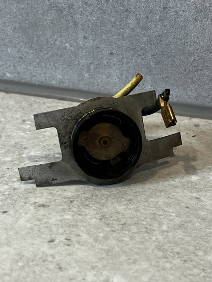 Rear view of metal high-temperature thermal switch showing mounting plate