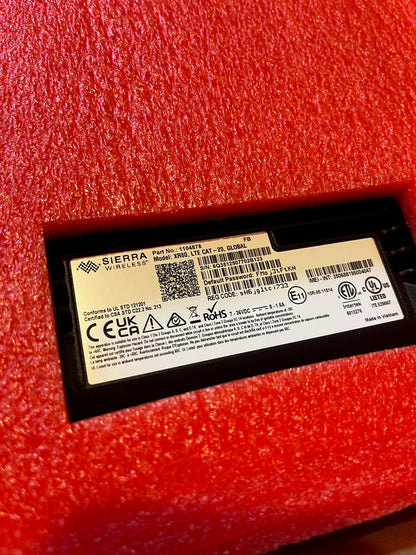 Close-up of AirLink XR80 router label with model and certification details