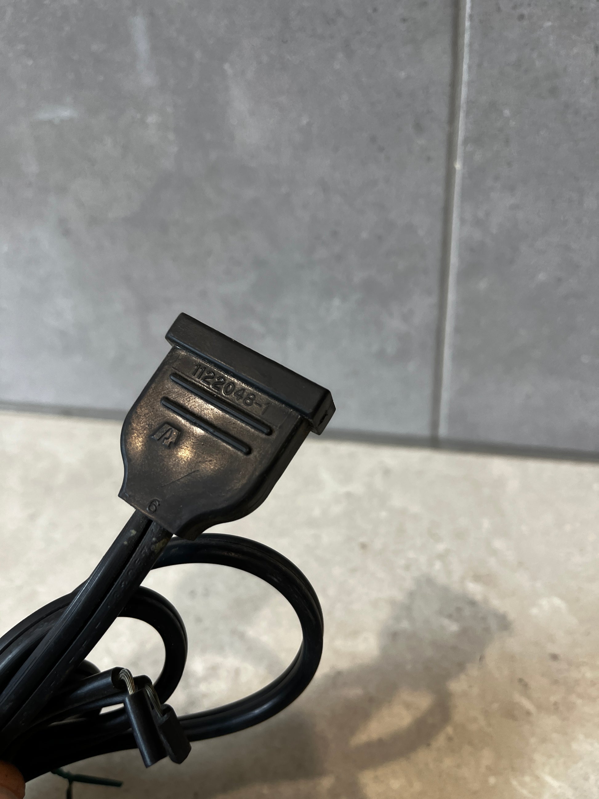 End of power cord with molded plug and visible marking