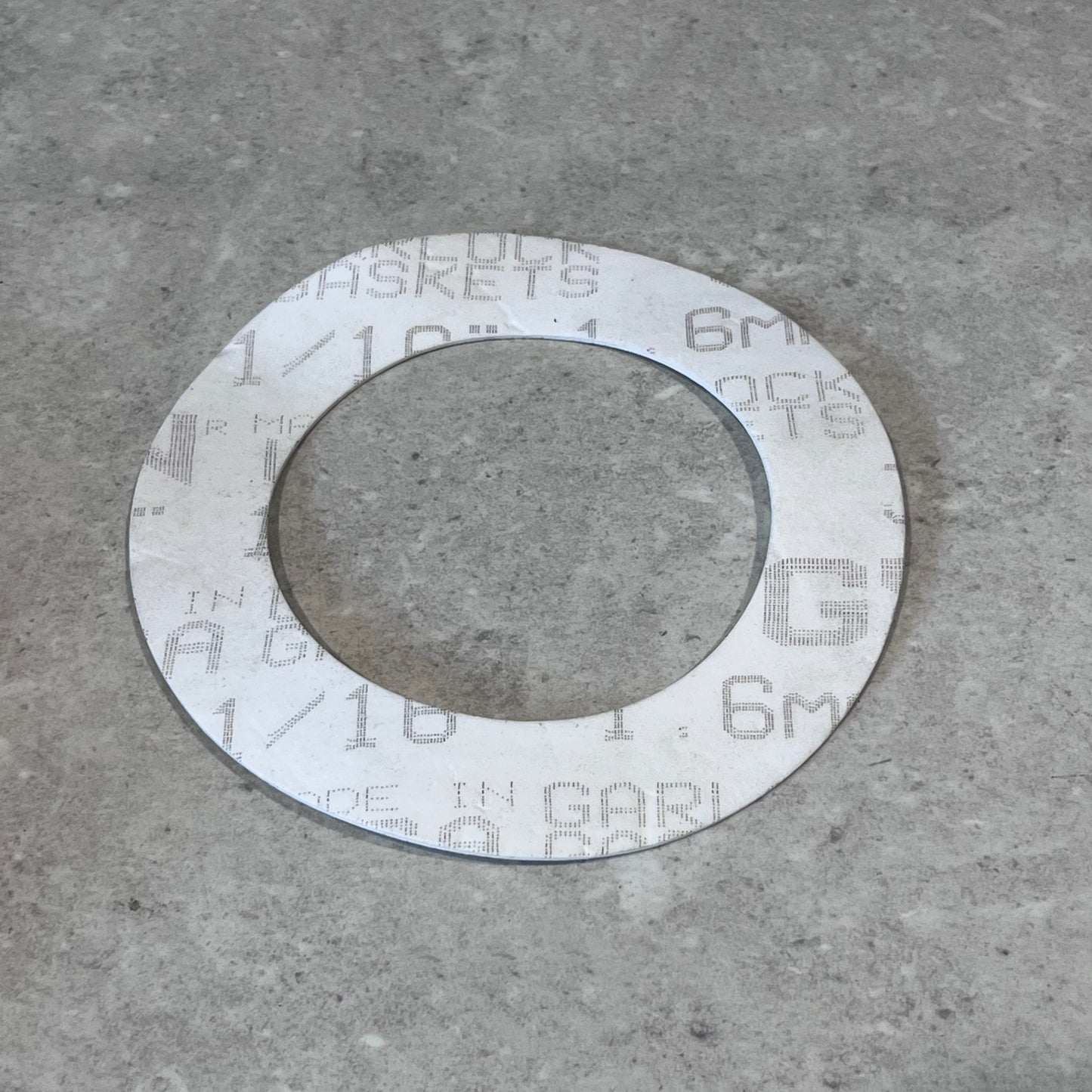 Garlock PTFE gasket with printed specifications visible