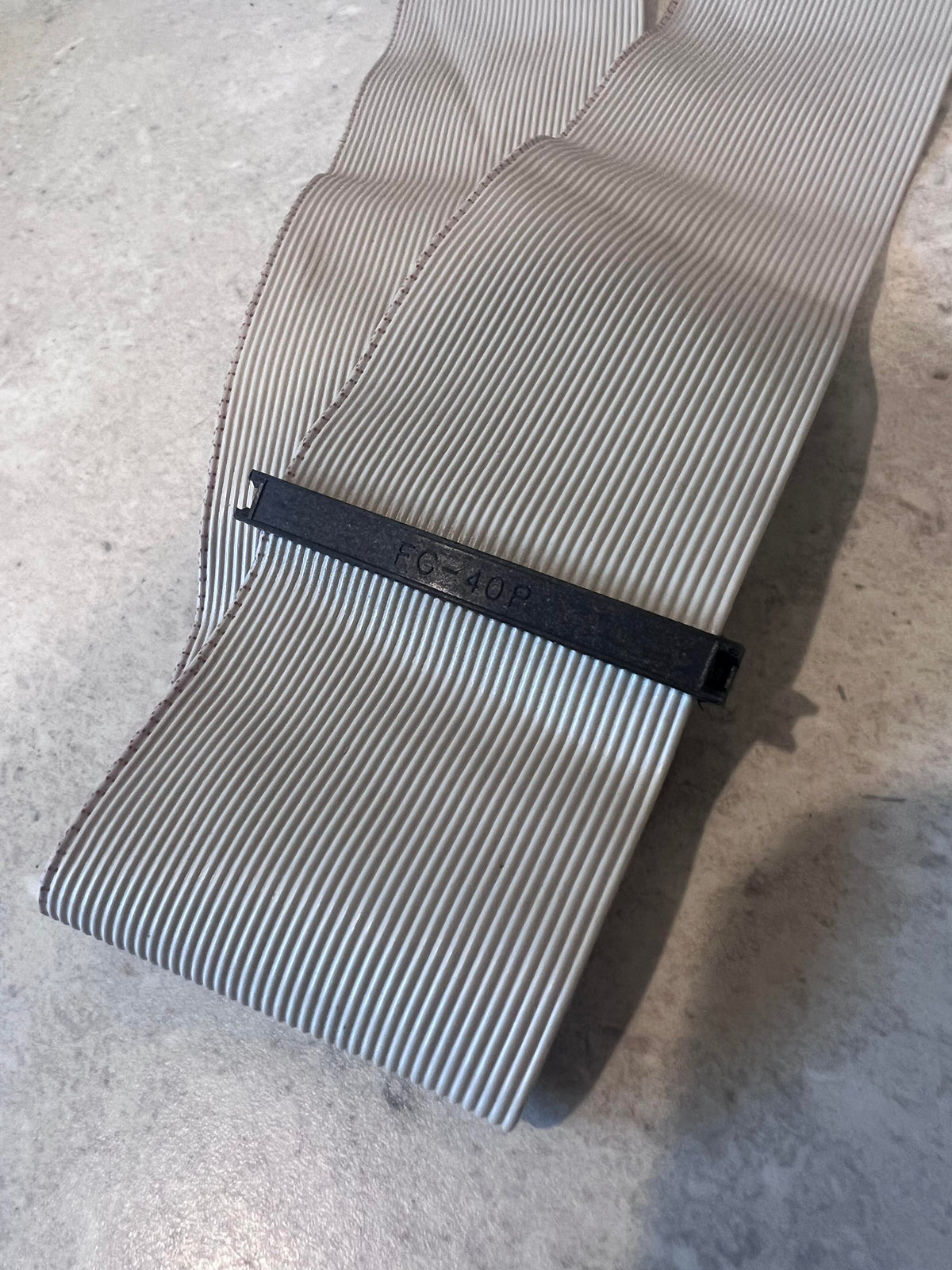Detail view of 40-pin IDC ribbon cable showing marking and connector