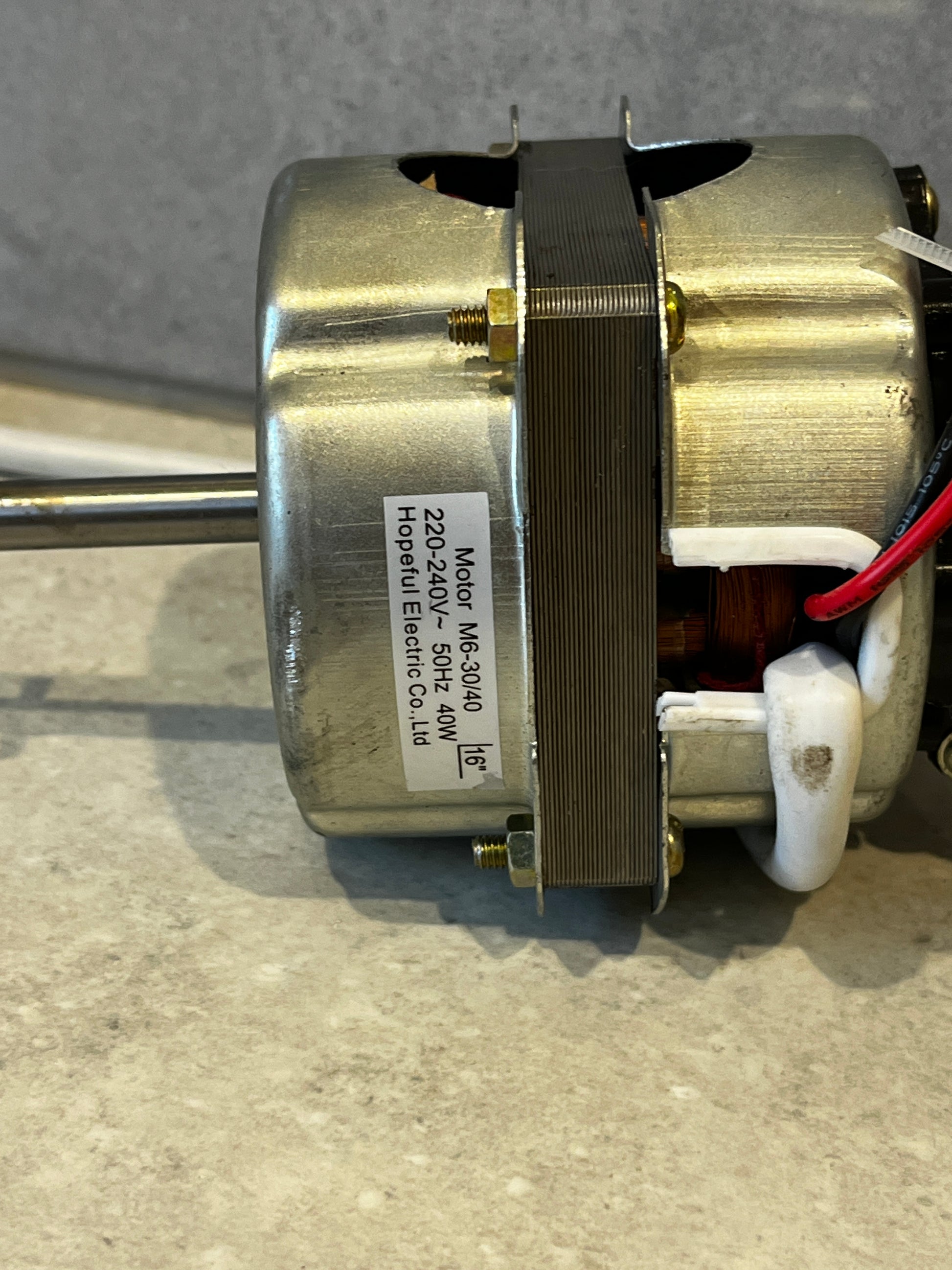 Close-up of motor label showing specifications: 220-240V, 40W, 50Hz from Hopeful Electric Co. Ltd.