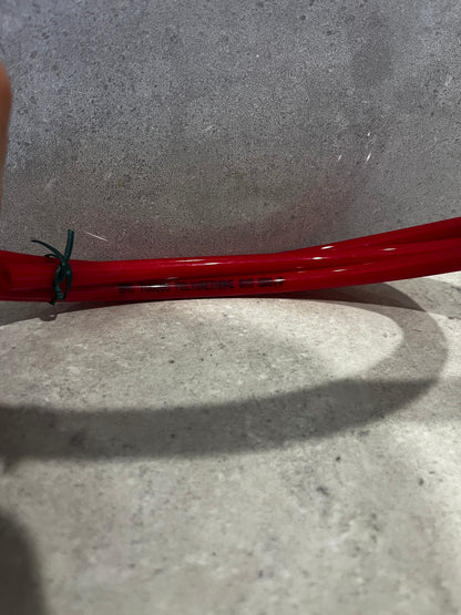 Side view showing text printed on red polyurethane tubing