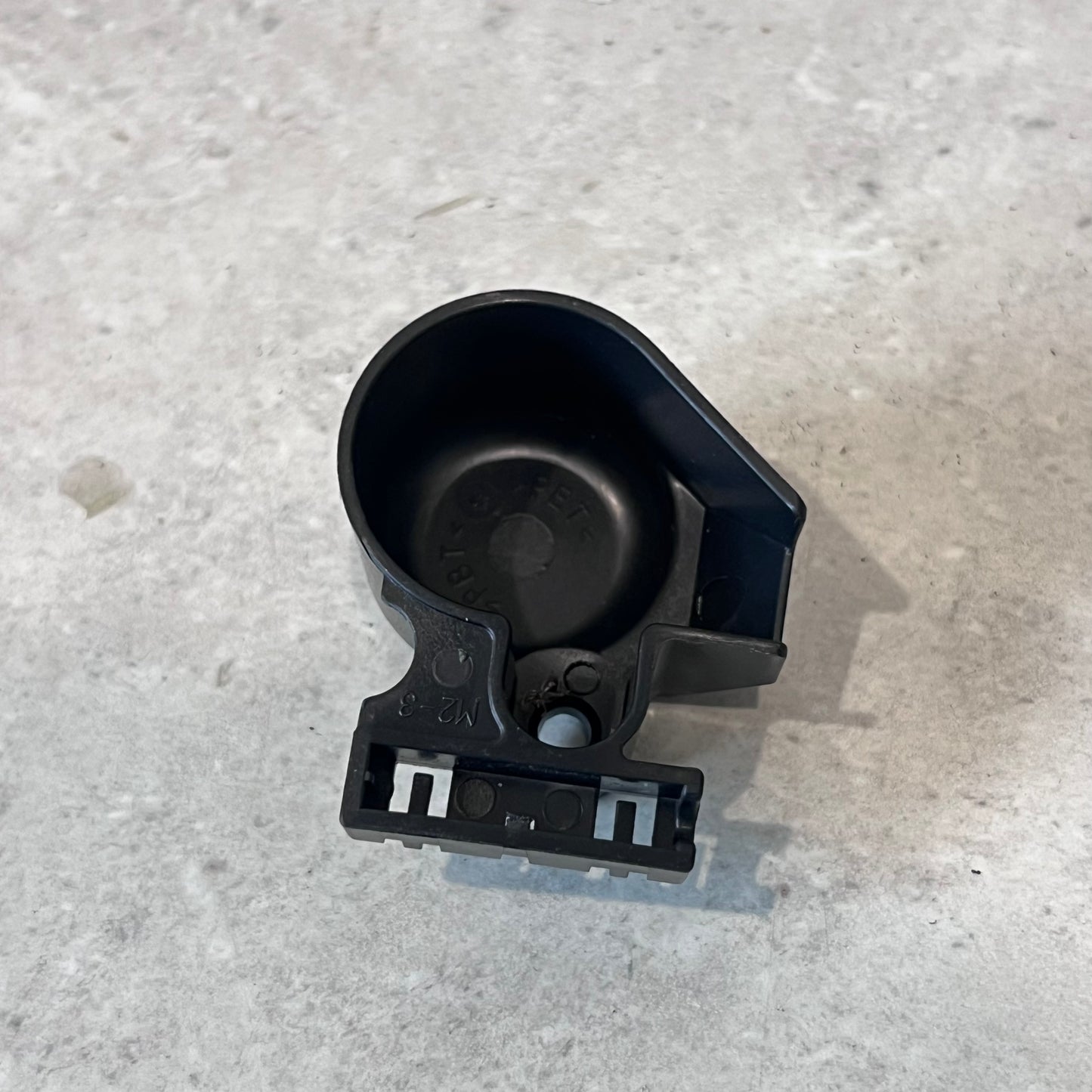 Black plastic CWH17039A terminal cover viewed from below showing attachment points