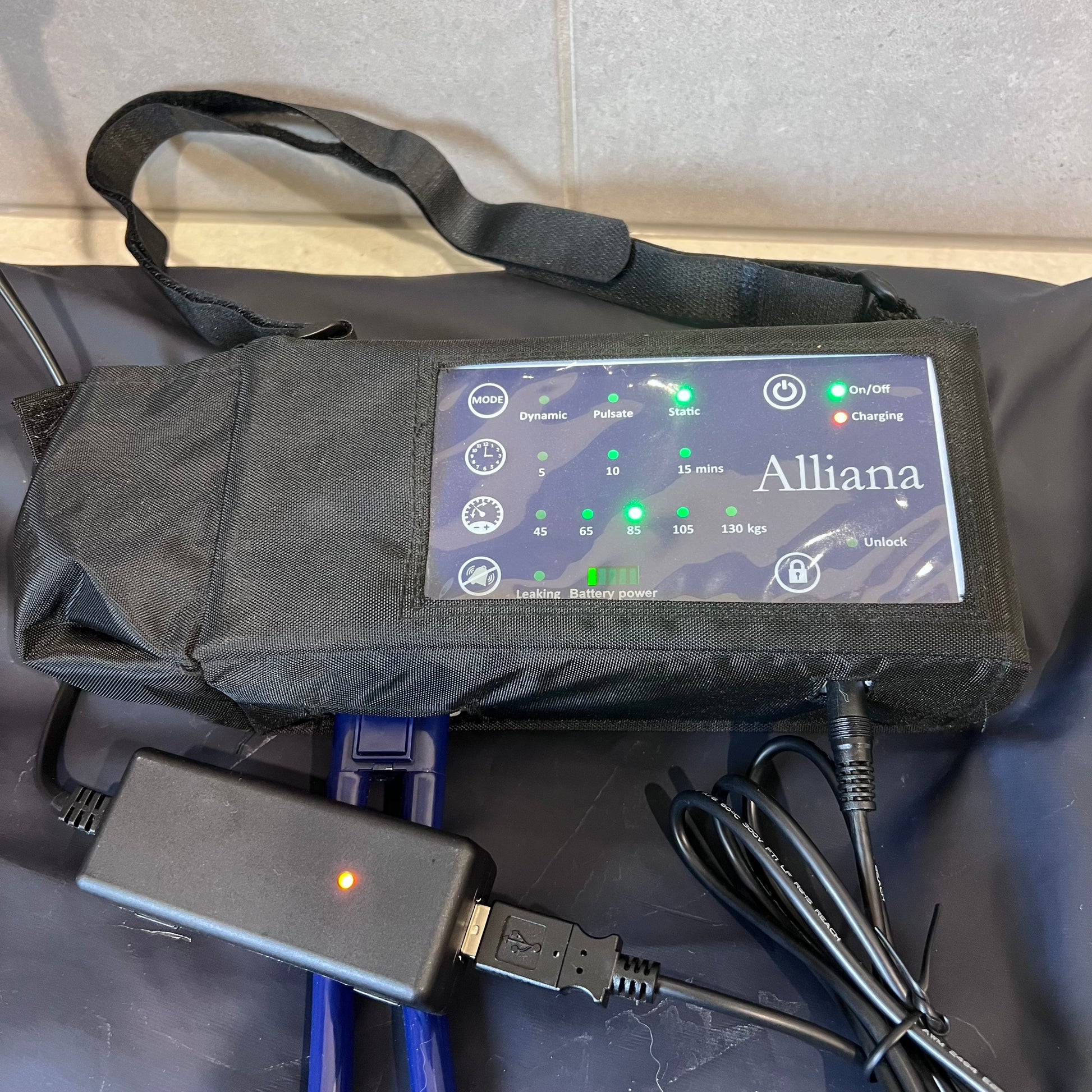 Close-up of Alliana cushion pump control panel and charger