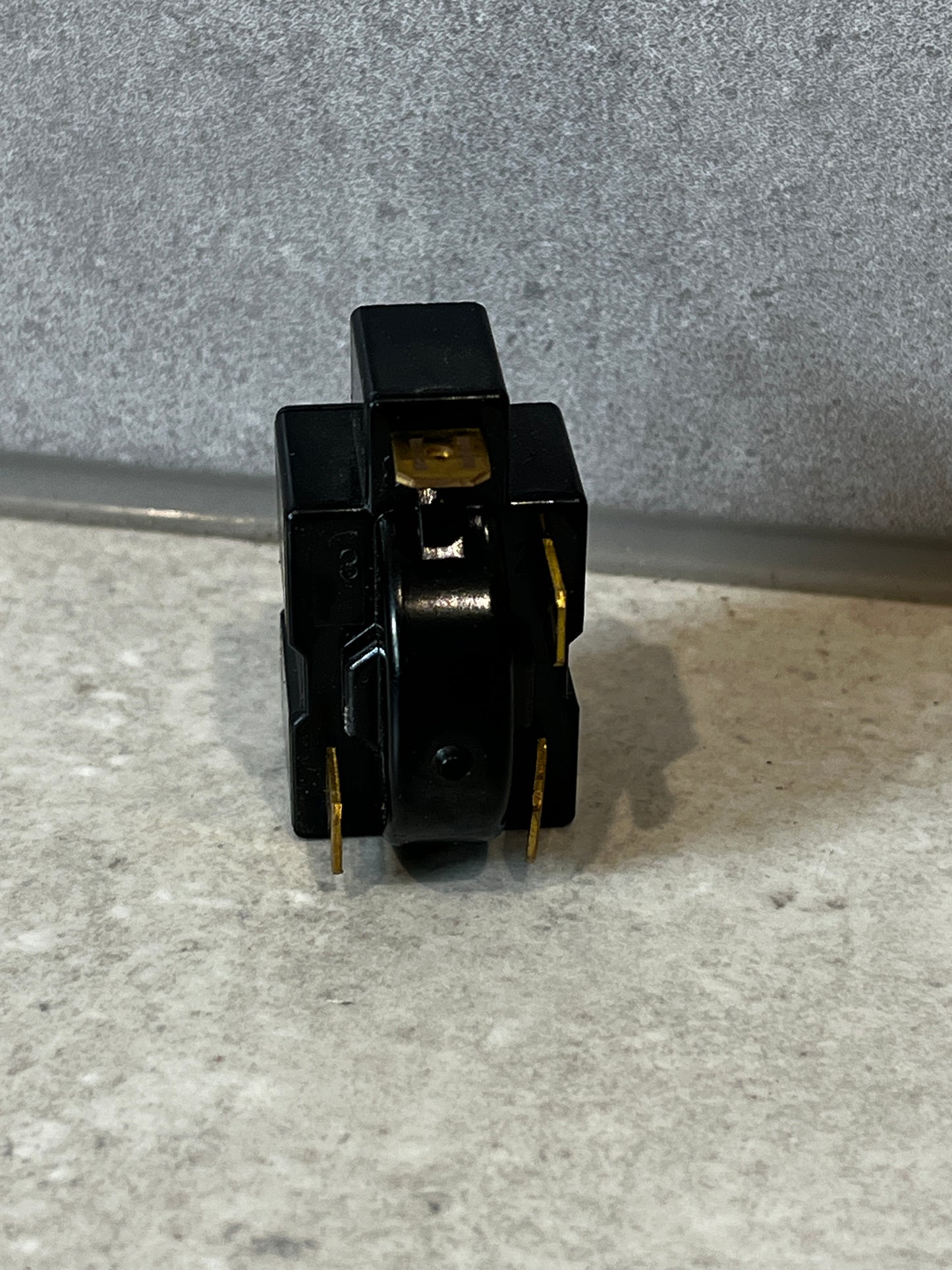 Side view of electrical relay switch with connectors