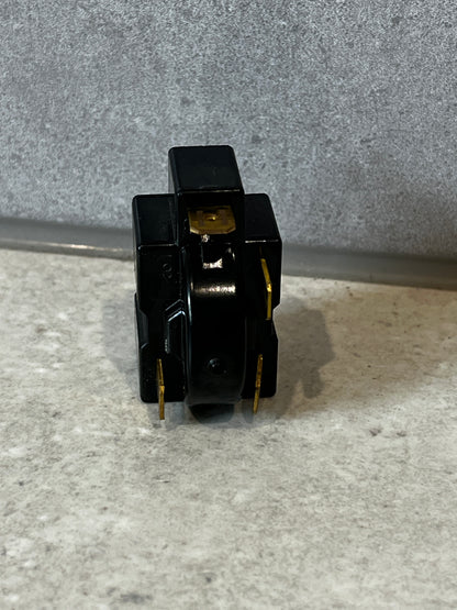 Side view of electrical relay switch with connectors
