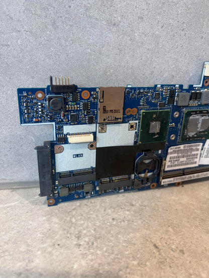 Close-up of WLAN slot and circuit details on Lenovo laptop motherboard
