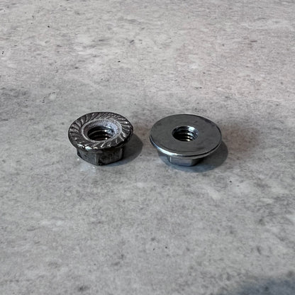 Bottom view of two metal flange nuts showing serrated and smooth flanges