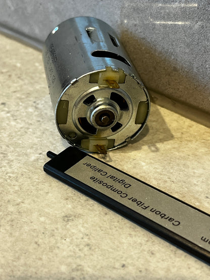 Front view of electric DC motor showing ventilation slots and electrical connectors
