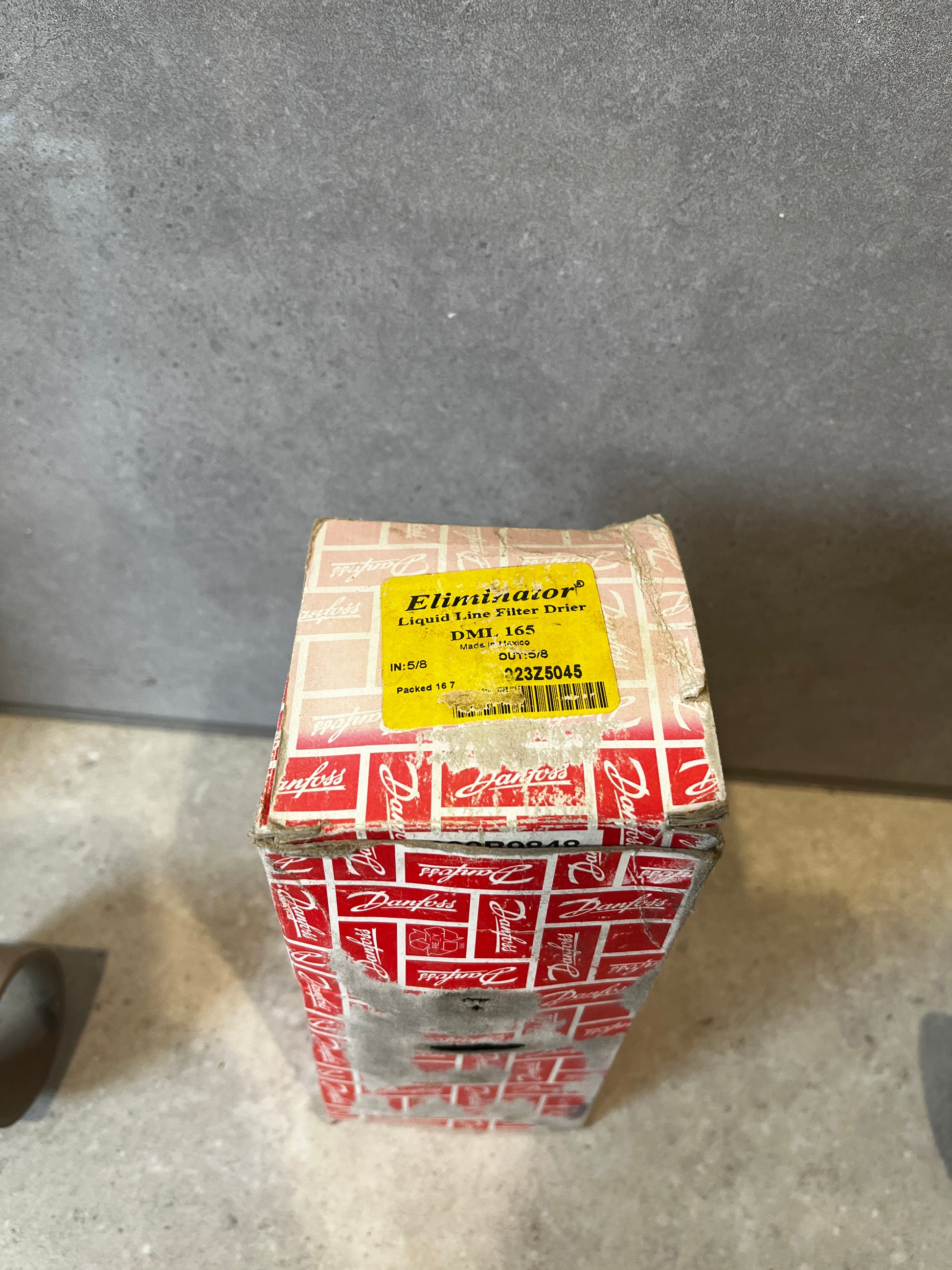 Top view of Danfoss Eliminator Filter Drier packaging with product label