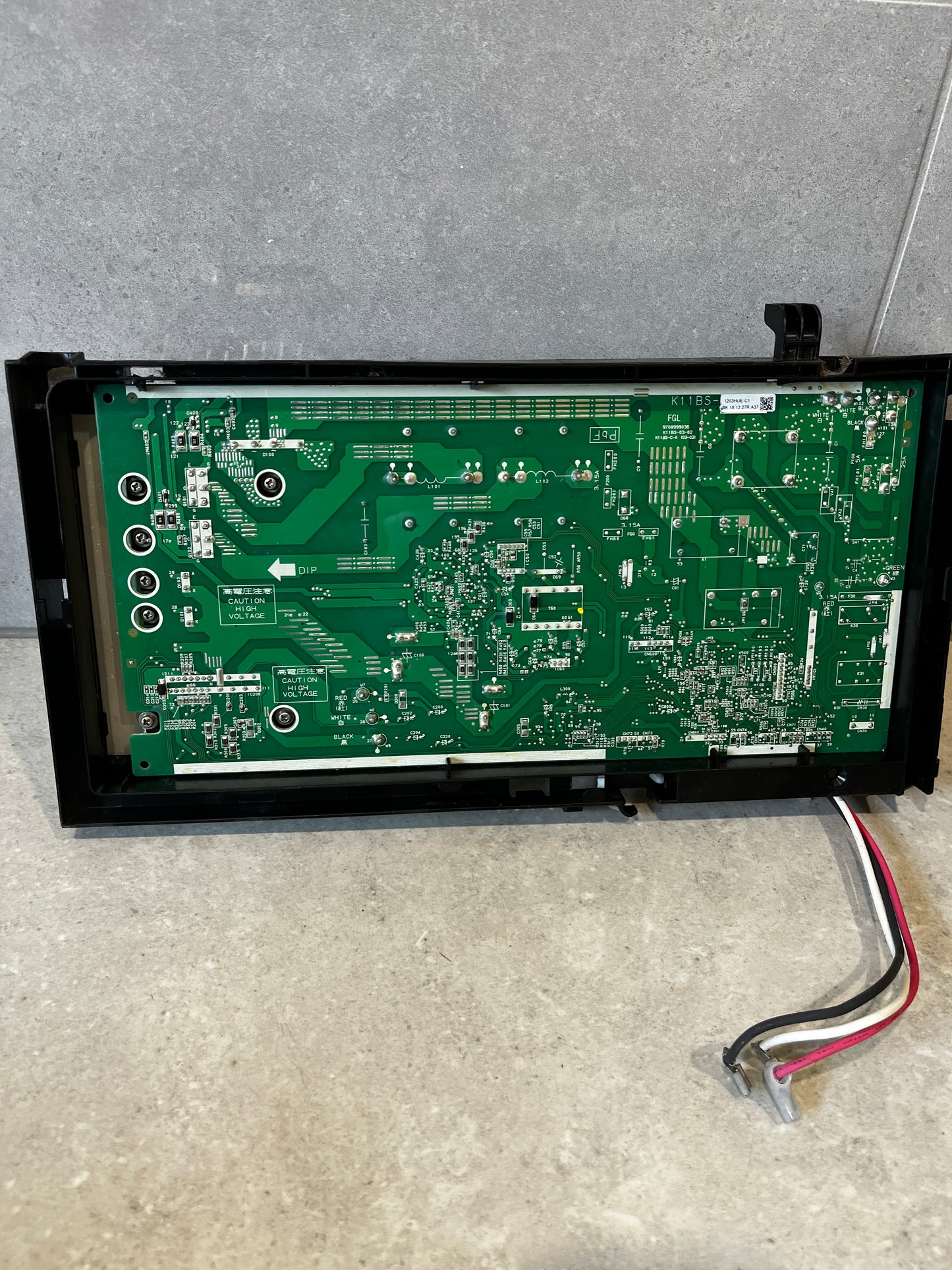 Rear view of electronic power control board showing detailed PCB layout