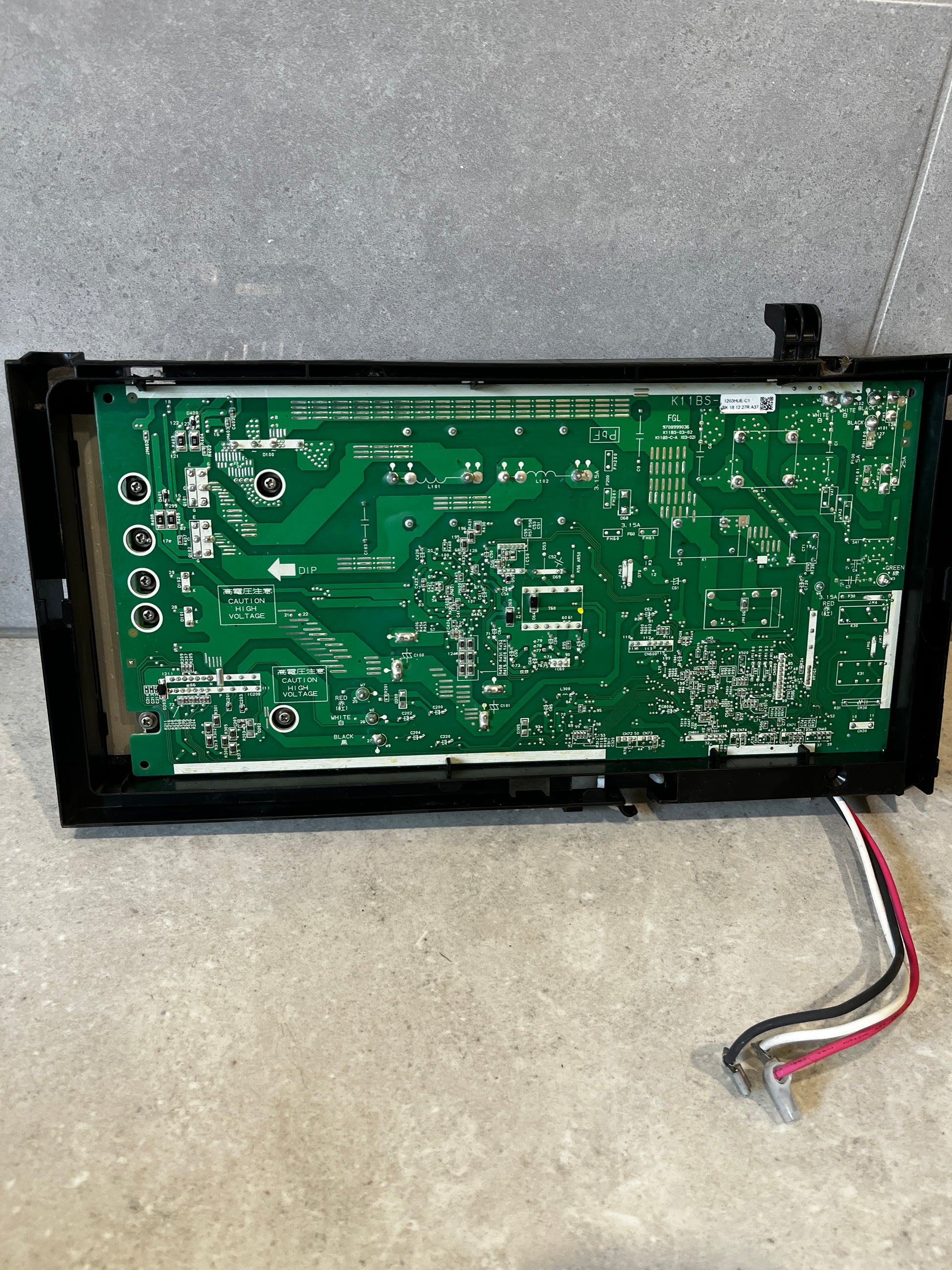 Rear view of electronic power control board showing detailed PCB layout