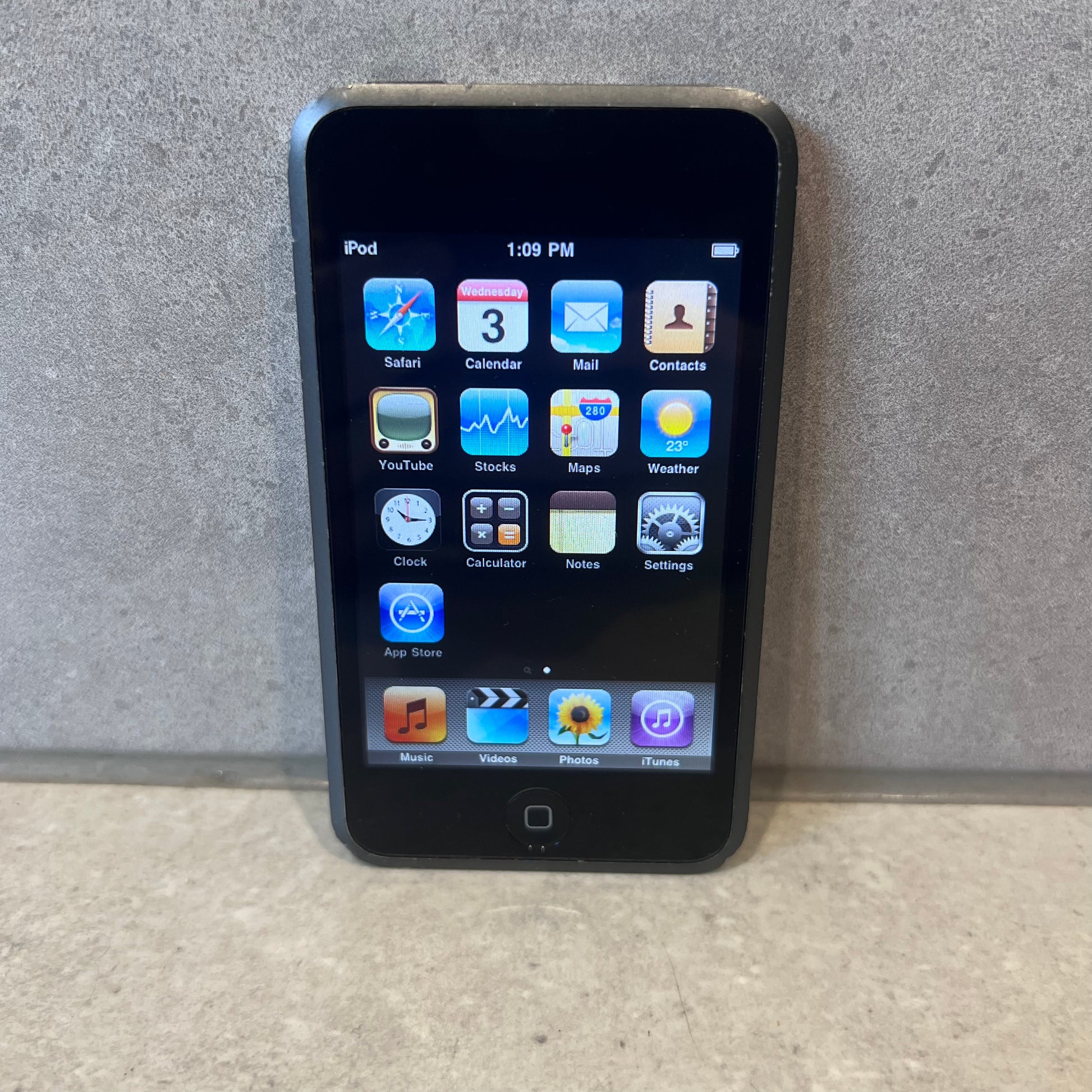 Apple iPod Touch home screen with default app icons displayed