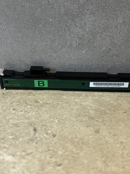 Close-up of thermal printhead circuit board with green 'B' label and barcode