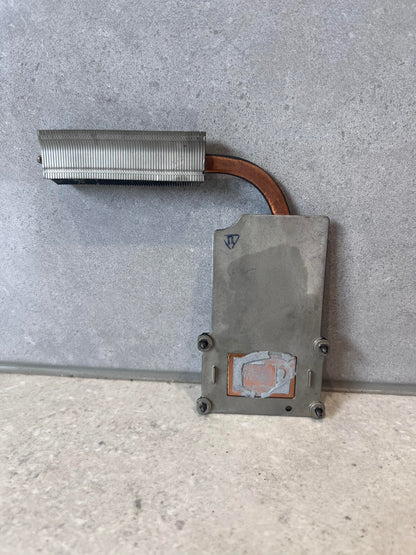 Rear view of HP laptop heatsink showing copper pipe and metal contact plate