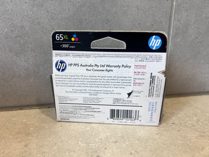 Back of HP 65XL Tri-Color Ink Cartridge packaging showing warranty and compatibility