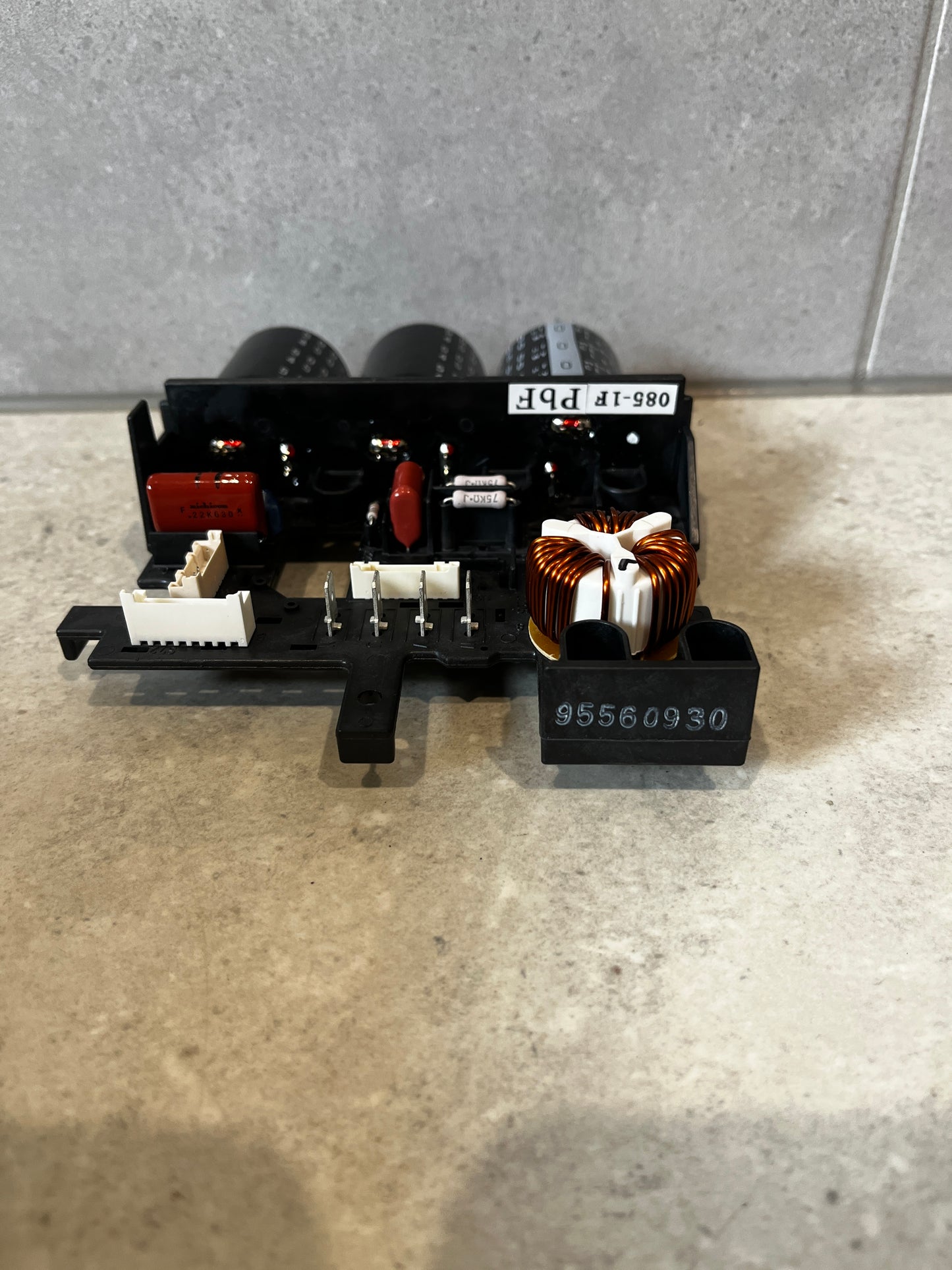 Rear angle of Daikin inverter PCB assembly showing connectors and components