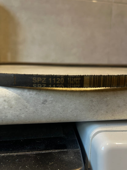 Detailed view of SPZ 1120 marking on industrial V-belt