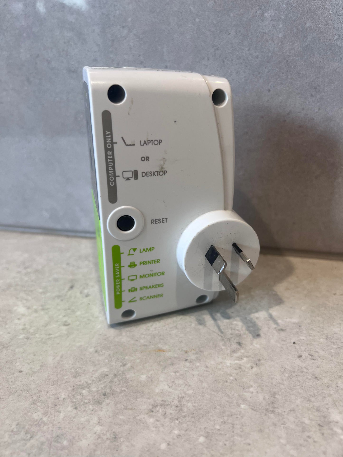 Side view of Embertec PC power saver plug with visible prongs and labeled device compatibility