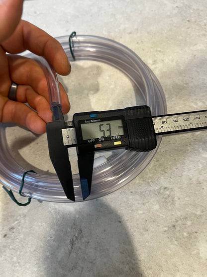 Measuring inner diameter of clear PVC tubing showing 5.3 millimeters on digital caliper