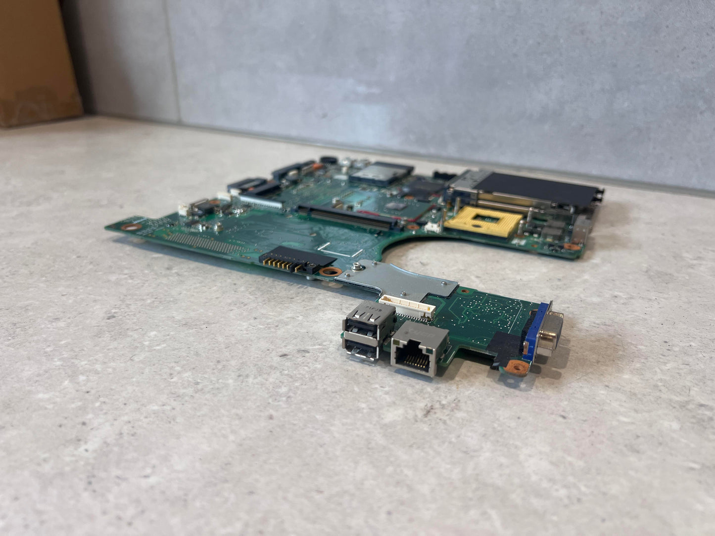 Low-angle view of motherboard ports including USB and VGA