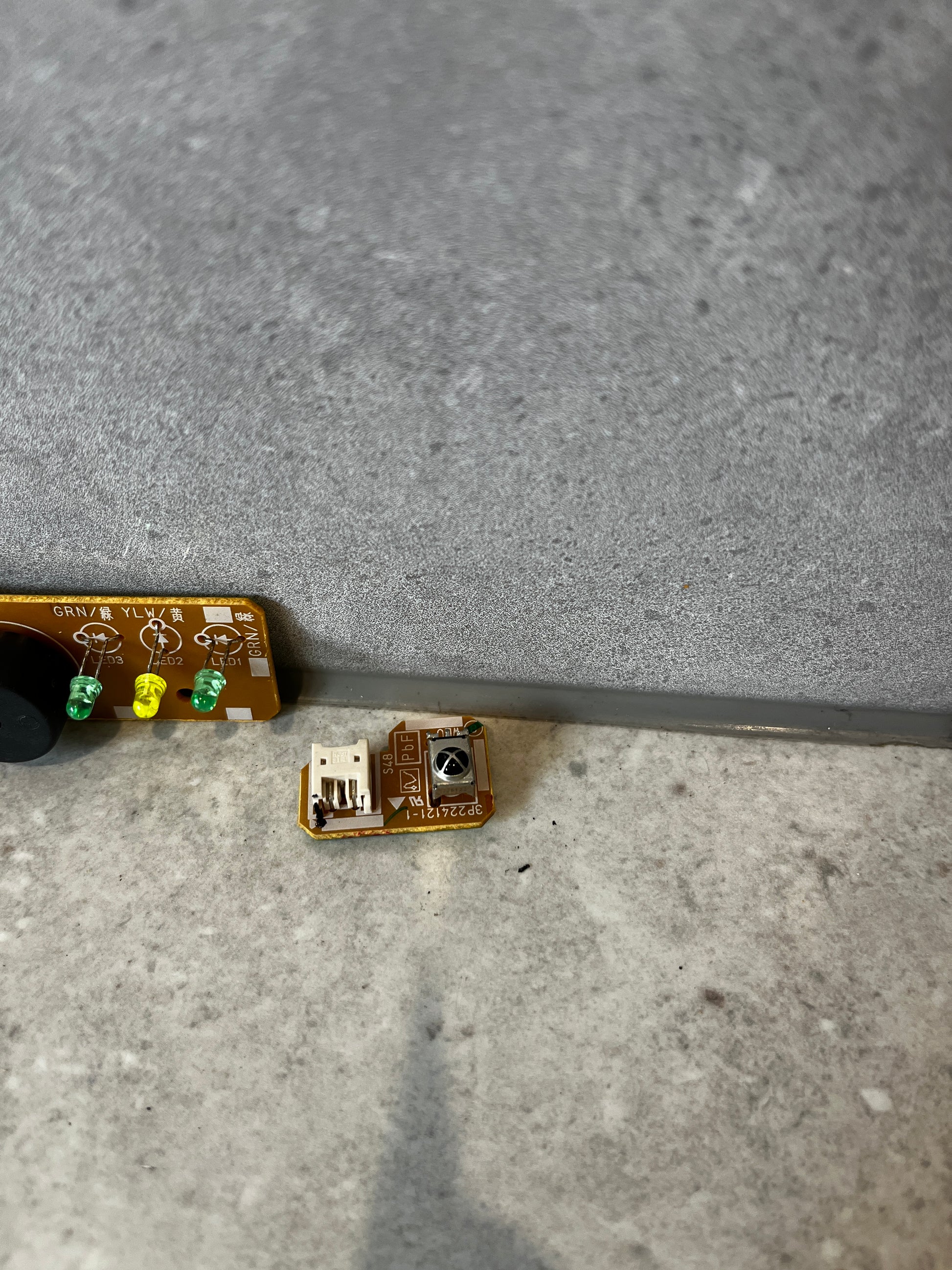 Detail view of small Daikin circuit board component with connector