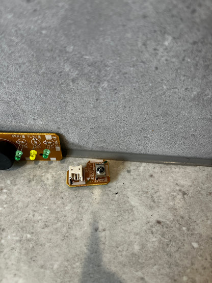 Detail view of small Daikin circuit board component with connector