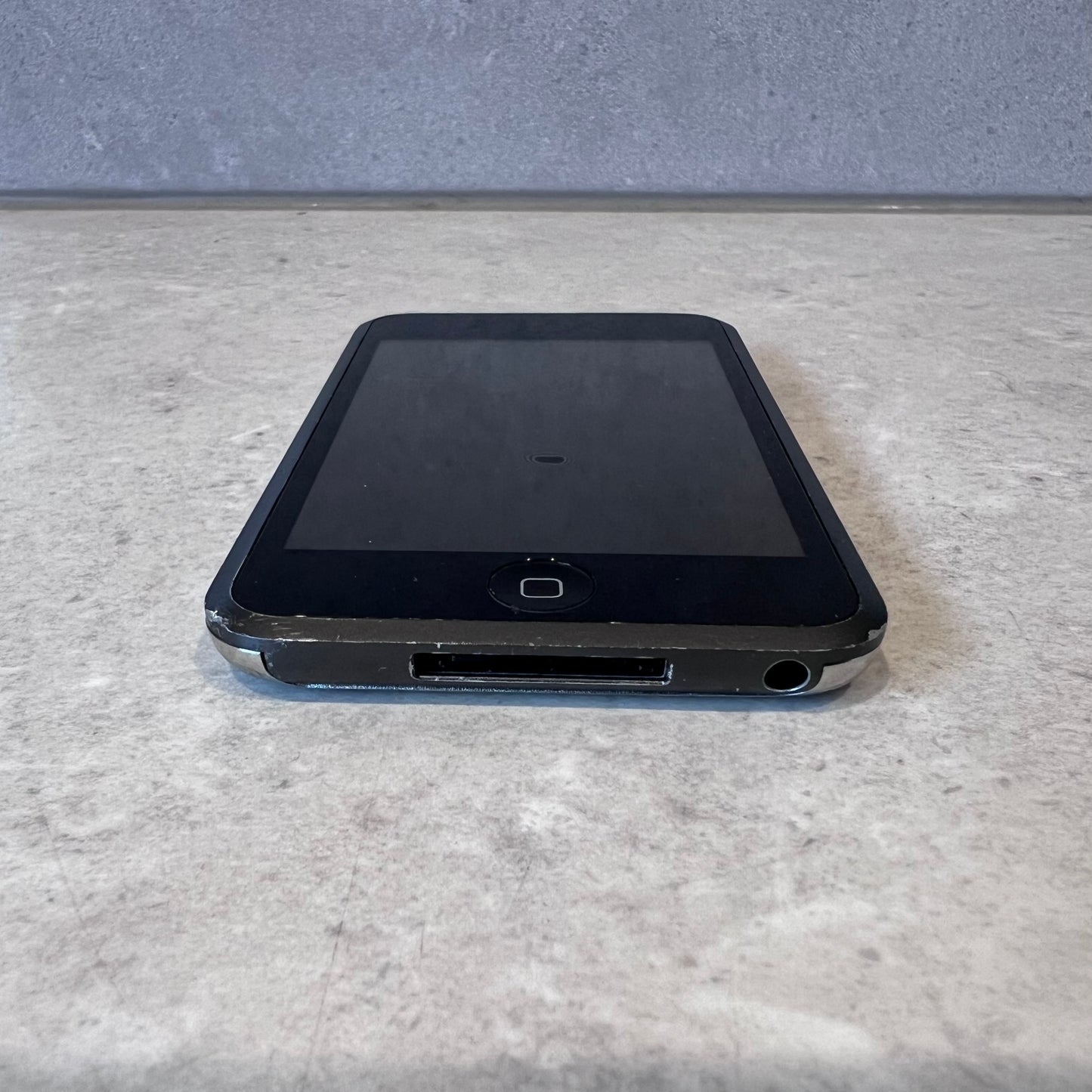 Bottom view of iPod Touch showing headphone jack and charging port