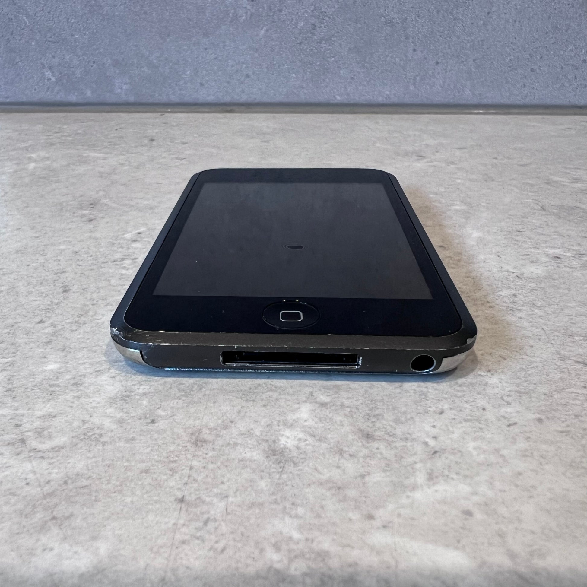 Bottom view of iPod Touch showing headphone jack and charging port