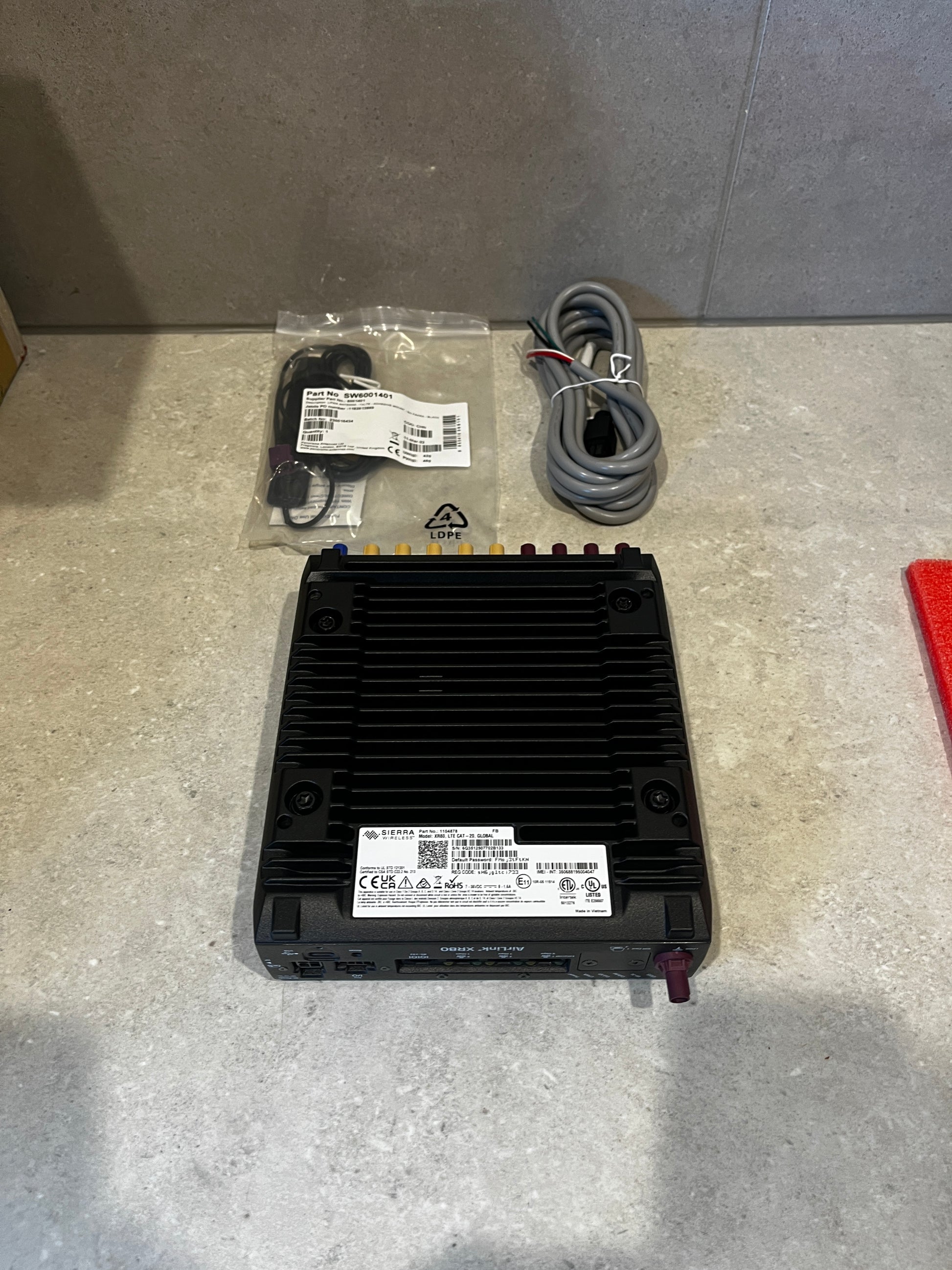 AirLink XR80 router front view including ports and connectors on a light surface