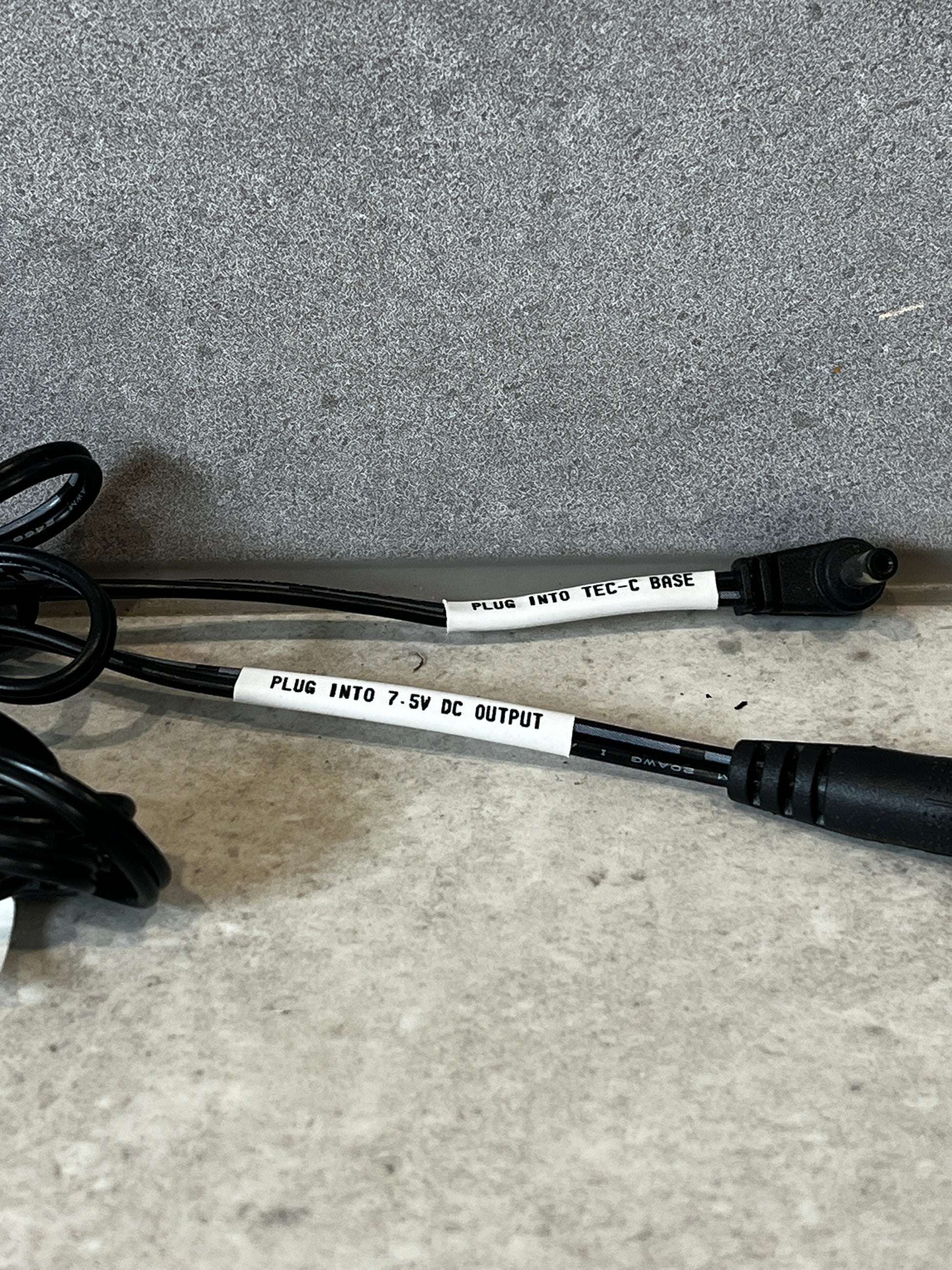 Zoom-in of two labeled ends: 'PLUG INTO TEC-C BASE' and 'PLUG INTO 7.5V DC OUTPUT'