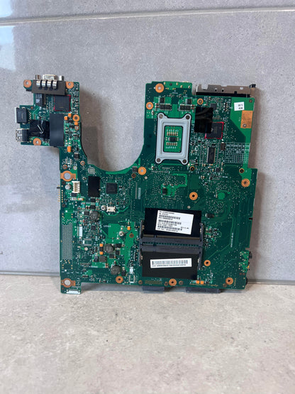 Rear view of laptop motherboard with component slots