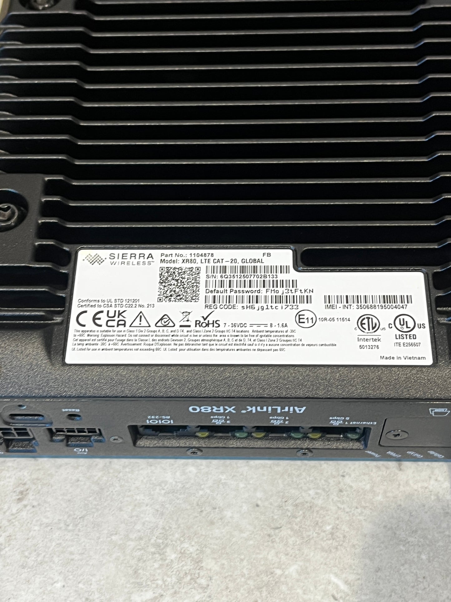 Close-up of router label showing regulatory and technical information