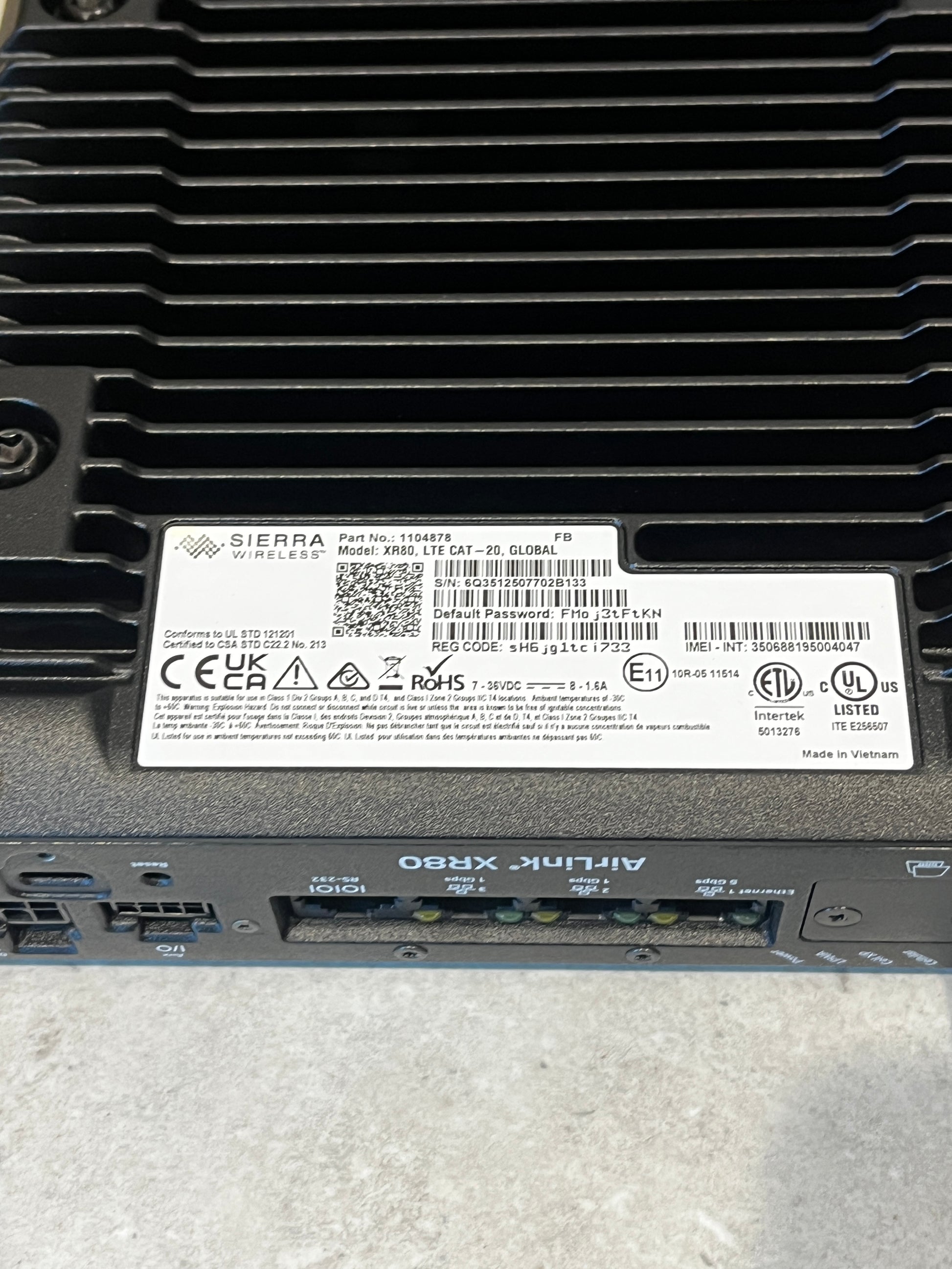 Close-up of router label showing regulatory and technical information